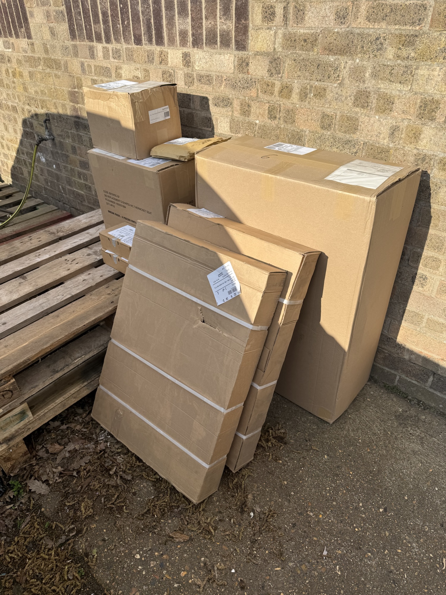 New display boxes arriving outside Bubblegum Bathrooms showroom