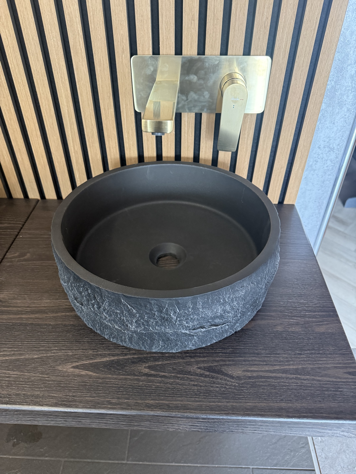 Right-hand display with Scudo Roc round basin and brass Abode Aquip tap